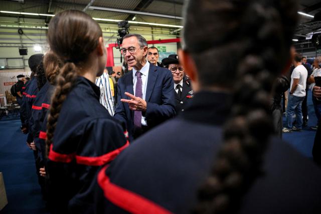 Right wing party Les Republicains (LR) candidate in France's 2027 presidential election Bruno Retailleau speaks to firefighters during a visit to the World Rescue and Protection Congress, organised by the National Federation of French Firefighters, in La Roche-Sur-Foron, central-eastern France, on October 2, 2026. (Photo by OLIVIER CHASSIGNOLE / AFP)