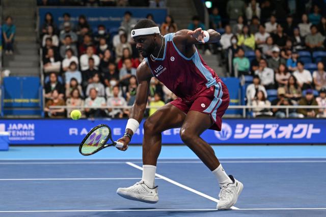USA's Frances Tiafoe hits a return to France's Arthur Fils during their men's singles match at the ATP Tour Japan Open Tennis Championships at the Ariake Tennis Forest Park in Tokyo on October 2, 2026. (Photo by Rie KIKUCHI / AFP)
