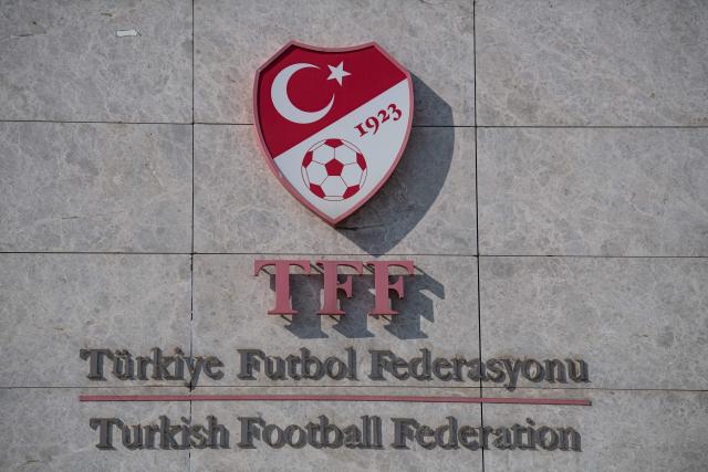 (FILES) This picture taken on May 6, 2020 in Istanbul shows a logo of Turkish Football Federation (TFF) at the entrance of the organization's headquarters. The head of Turkey's football refereeing body and six others were to appear in court on October 2, 2026, three days after being detained as part of a graft investigation, media reports said. Ferhat Gundogdu and his vice-president were detained alongside five others on Tuesday as part of a probe into allegations of top-level manipulation of the referee administration process. (Photo by Ozan KOSE / AFP)