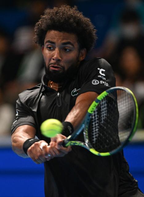 France's Arthur Fils hits a return to USA's Frances Tiafoe during their men's singles match at the ATP Tour Japan Open Tennis Championships at the Ariake Tennis Forest Park in Tokyo on October 2, 2026. (Photo by Rie KIKUCHI / AFP)