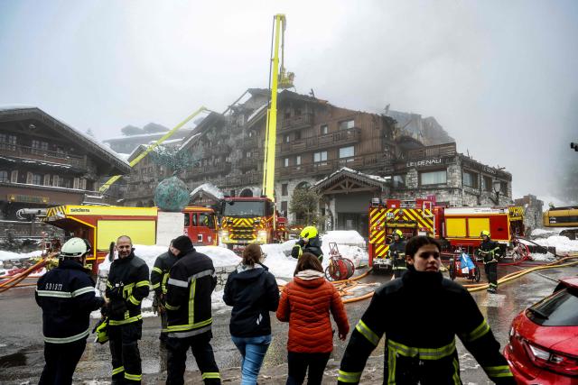 (FILES) Firefighters work on a fire that broke out the evening before at the five-star Grandes Alpes hotel in the upscale French Alpine ski resort of Courchevel, forcing the evacuation of 83 occupants, on January 28, 2026. The appeal trial over the fatal Courchevel fire is scheduled to continue until Octobre 7, 2026. (Photo by Alex MARTIN / AFP)