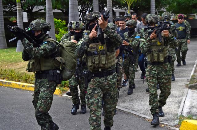 Members of the Colombian Army take part in an anti-terrorism drill simulating a hostage-taking and rescue operation at the Palace of Justice in Cucuta, Colombia on October 2, 2026. (Photo by Schneyder Mendoza / AFP)