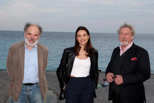 French actor Jean Pierre Darroussin (L), French actress Marilou Aussilloux (C) and French director Robert Guediguian (R) pose during a photocall for the film "Une femme d'aujourd'hui" part of the 8th edition of the Cineroman film festival in Nice, south-eastern France, on October 2, 2026. (Photo by Valery HACHE / AFP)