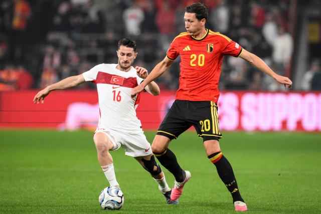 Turkey's midfielder #16 Ismail Yuksek (L) fights for the ball with Belgium's midfielder #20 Hans Vanaken during the UEFA Nations League, League A - Group 1, football match between Belgium and Turkey at the Maurice Dufrasne stadium, in Liege, eastern Belgium on October 2, 2026. (Photo by JOHN THYS / AFP)