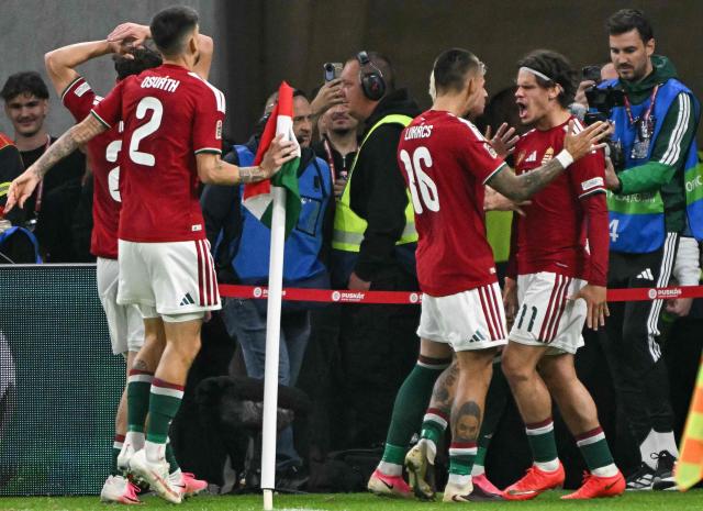 Hungary's midfielder #11 Milos Kerkez (E) celebrates scoring the opening goal with his teammates including Hungary's forward #16 Daniel Lukacs during the UEFA Nations League Group B2 football match between Hungary and Georgia at the Puskas Arena in Budapest, Hungary on October 2, 2026. (Photo by Attila KISBENEDEK / AFP)