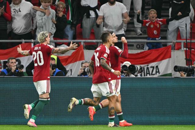 Hungary's midfielder #11 Milos Kerkez (R) celebrates scoring the opening goal with his teammates during the UEFA Nations League Group B2 football match between Hungary and Georgia at the Puskas Arena in Budapest, Hungary on October 2, 2026. (Photo by Attila KISBENEDEK / AFP)