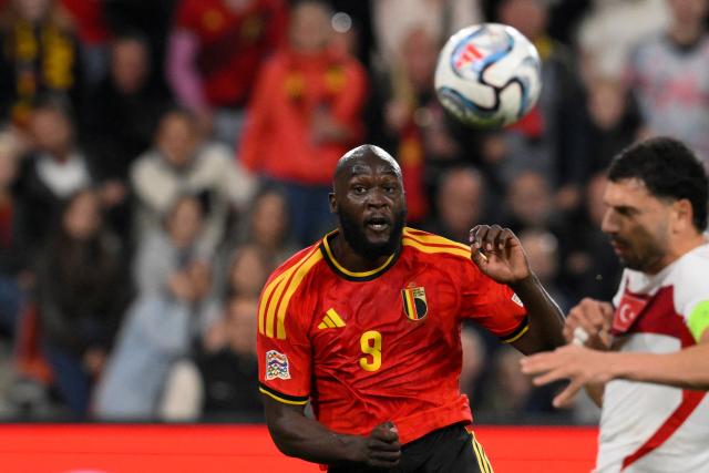 Belgium's forward #09 Romelu Lukaku (L) eyes the ball as he shoots to score his team third goal during the UEFA Nations League, League A - Group 1, football match between Belgium and Turkey at the Maurice Dufrasne stadium, in Liege, eastern Belgium on October 2, 2026. (Photo by JOHN THYS / AFP)
