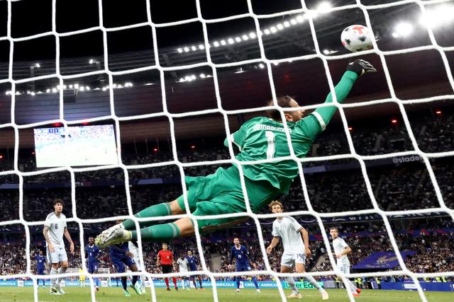 Italy's goalkeeper #01 Gianluigi Donnarumma makes a safe during the UEFA Nations League, league A day 3: Group 1, football match between France and Italy at the Stade de France stadium in Saint-Denis, near Paris, on October 2, 2026. (Photo by FRANCK FIFE / AFP)