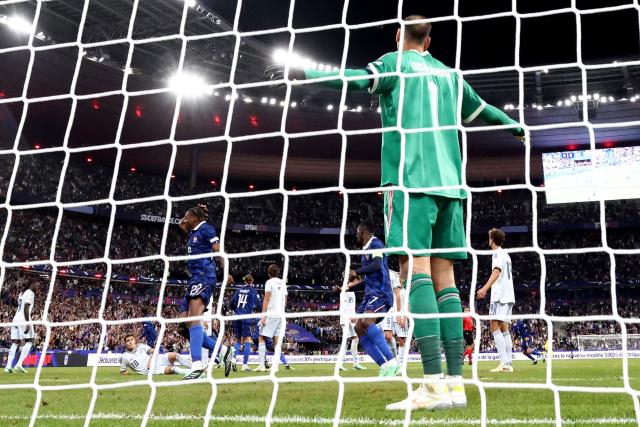 Italy's goalkeeper #01 Gianluigi Donnarumma (R) reacts after France scored a goal during the UEFA Nations League, league A day 3: Group 1, football match between France and Italy at the Stade de France stadium in Saint-Denis, near Paris, on October 2, 2026. (Photo by FRANCK FIFE / AFP)