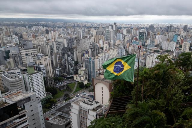 This aerial view shows a Brazilian flag on top of the Hotel Rosewood in Sao Paulo, Brazil on October 2, 2026. (Photo by Luis ROBAYO / AFP)