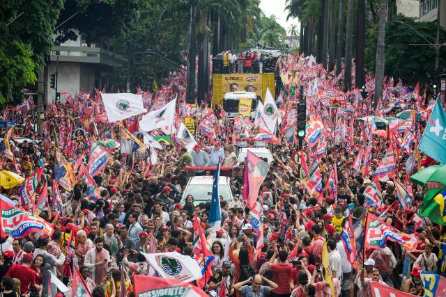 Brazil's President and presidential candidate Luiz Inacio Lula da Silva (2nd-L) attends a campaign rally in Belo Horizonte, Minas Gerais state, Brazil on October 2, 2026. Brazilians go to the polls on October 4, 2026, in a tight race led by leftist President Luiz Inacio Lula da Silva and right-wing senator Flavio Bolsonaro, son of former president Jair Bolsonaro. (Photo by Gledston Tavares / AFP)