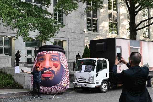 An inflatable balloon in the likeness of Saudi Crown Prince Mohammed bin Salman stands outside the Saudi Arabia Embassy to mark the 8th anniversary of the killing of Saudi journalist Jamal Khashoggi in Washington, DC on October 2, 2026. The organizations Democracy for the Arab World Now (DAWN), founded by Khashoggi, and Arab Rights and Research Center (ARRC) continue calling for accountability in the assasination of the journalist and activist inside the Saudi consulate in Istambul in 2018. (Photo by Alex WROBLEWSKI / AFP)