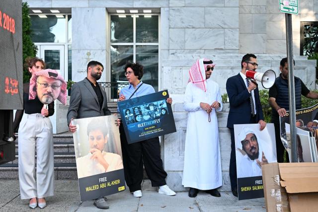 People protest outside the Saudi Arabia Embassy to mark the 8th anniversary of the killing of Saudi journalist Jamal Khashoggi in Washington, DC on October 2, 2026. The organizations Democracy for the Arab World Now (DAWN), founded by Khashoggi, and Arab Rights and Research Center (ARRC) continue calling for accountability in the assasination of the journalist and activist inside the Saudi consulate in Istambul in 2018. (Photo by Alex WROBLEWSKI / AFP)