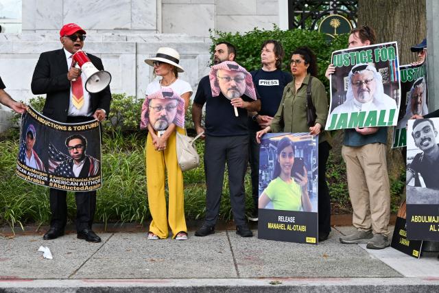 People protest outside the Saudi Arabia Embassy to mark the 8th anniversary of the killing of Saudi journalist Jamal Khashoggi in Washington, DC on October 2, 2026. The organizations Democracy for the Arab World Now (DAWN), founded by Khashoggi, and Arab Rights and Research Center (ARRC) continue calling for accountability in the assasination of the journalist and activist inside the Saudi consulate in Istambul in 2018. (Photo by Alex WROBLEWSKI / AFP)