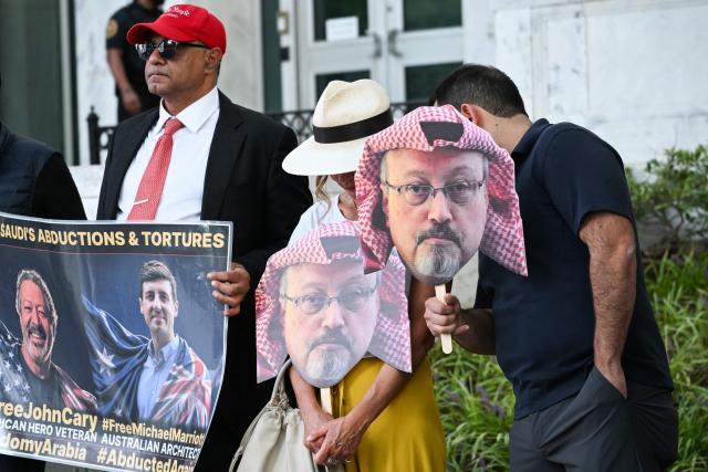 People protest outside the Saudi Arabia Embassy to mark the 8th anniversary of the killing of Saudi journalist Jamal Khashoggi in Washington, DC on October 2, 2026. The organizations Democracy for the Arab World Now (DAWN), founded by Khashoggi, and Arab Rights and Research Center (ARRC) continue calling for accountability in the assasination of the journalist and activist inside the Saudi consulate in Istambul in 2018. (Photo by Alex WROBLEWSKI / AFP)