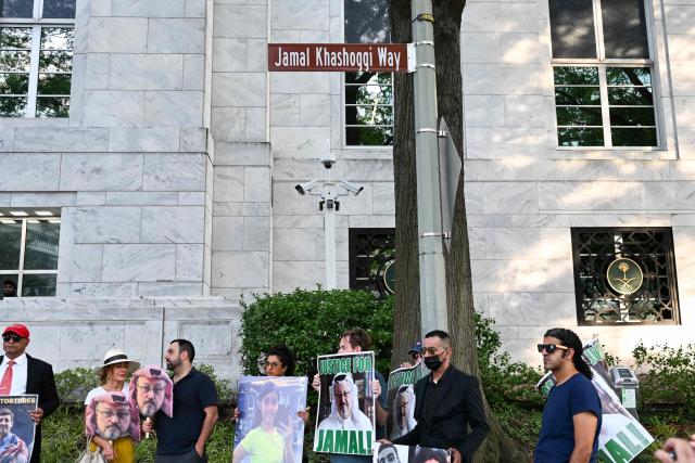 People protest outside the Saudi Arabia Embassy to mark the 8th anniversary of the killing of Saudi journalist Jamal Khashoggi in Washington, DC on October 2, 2026. The organizations Democracy for the Arab World Now (DAWN), founded by Khashoggi, and Arab Rights and Research Center (ARRC) continue calling for accountability in the assasination of the journalist and activist inside the Saudi consulate in Istambul in 2018. (Photo by Alex WROBLEWSKI / AFP)