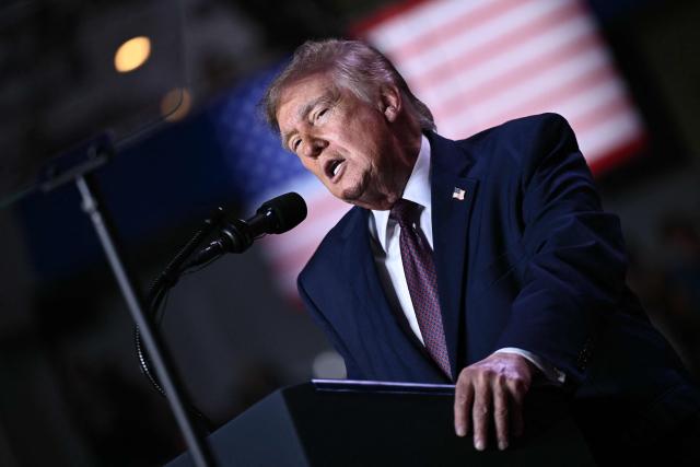 US President Donald Trump speaks during a midterm campaign rally at The Mitchell Center of the University of South Alabama in Mobile, Alabama on October 2, 2026. (Photo by Brendan SMIALOWSKI / AFP)