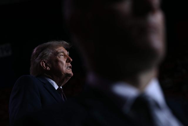 US President Donald Trump is seen on stage during a midterm campaign rally at The Mitchell Center of the University of South Alabama in Mobile, Alabama on October 2, 2026. (Photo by Brendan SMIALOWSKI / AFP)