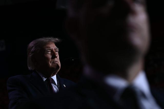 US President Donald Trump is seen on stage during a midterm campaign rally at The Mitchell Center of the University of South Alabama in Mobile, Alabama on October 2, 2026. (Photo by Brendan SMIALOWSKI / AFP)