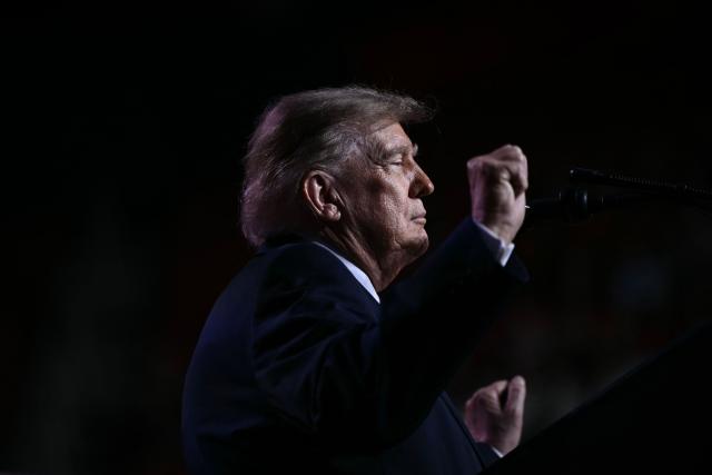 US President Donald Trump dances while speaking during a midterm campaign rally at The Mitchell Center of the University of South Alabama in Mobile, Alabama on October 2, 2026. (Photo by Brendan SMIALOWSKI / AFP)