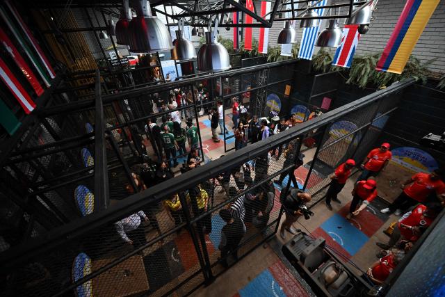 General view during the fourth edition of the Tejo World Championship, a traditional Colombian sport, in Bogota on October 2, 2026. Tejo is Colombia's national sport, in which players throw a heavy metal disc at a clay-filled target, aiming to hit small gunpowder-filled packets that explode on impact. (Photo by Raul ARBOLEDA / AFP)
