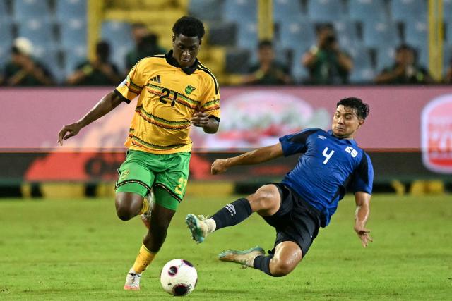 Jamaica's forward #21 Jahmarie Nolan and El Salvador's defender #04 Jorge Cruz fight for the ball during the Concacaf Nations League Cup football match between El Salvador and Jamaica at the Cuscatlan Stadium in San Salvador on October 2, 2026. (Photo by Marvin RECINOS / AFP)