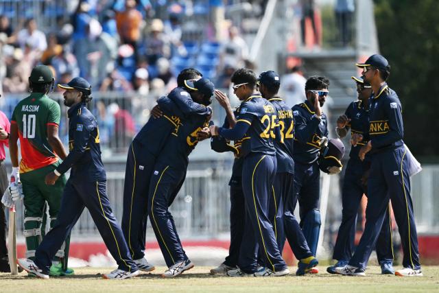Sri Lankan players celebrate their win against Bangladesh in their cricket match for bronze during the 2026 Asian Games at the Korogi Athletic Park in Nisshin on October 3, 2026. (Photo by ANDREW CABALLERO-REYNOLDS / AFP)