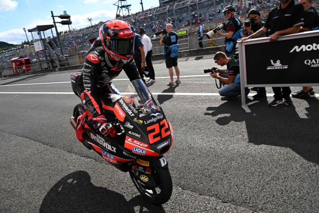 Liqui Moly Dynavolt Intract GP rider David Almansa of Spain performs jack knife in a celebration his pole position at the Parc Ferme of the Moto3 class qualifying session of MotoGP Japanese Grand Prix at the Mobility Resort Motegi in Motegi, Tochigi prefecture on October 3, 2026. (Photo by Toshifumi KITAMURA / AFP)
