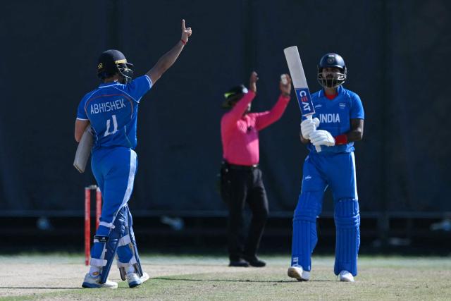 India's Abhishek Sharma (L) celebrates a half century during the men's cricket final match between Pakistan and India during the 2026 Asian Games at the Korogi Athletic Park in Nisshin on October 3, 2026. (Photo by ANDREW CABALLERO-REYNOLDS / AFP)
