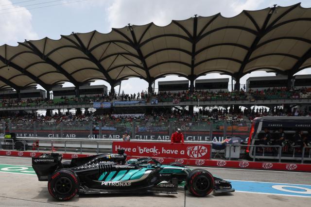 Mercedes' British driver George Russell steers out of his garage into the pit lane during the third practice session ahead of the Formula One Bahrain Grand Prix in Sepang on October 3, 2026. (Photo by I-HWA CHENG / AFP)