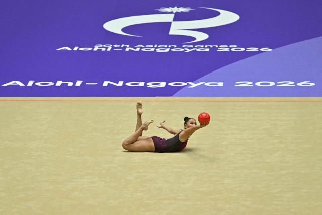 Kazakhstan's Akmaral Yerekesheva competes in the individual hoop for the rhythmic gymnastics finals during the 2026 Asian Games at the Nagoya General Gymnasium in Nagoya on October 3, 2026. (Photo by MOHD RASFAN / AFP)
