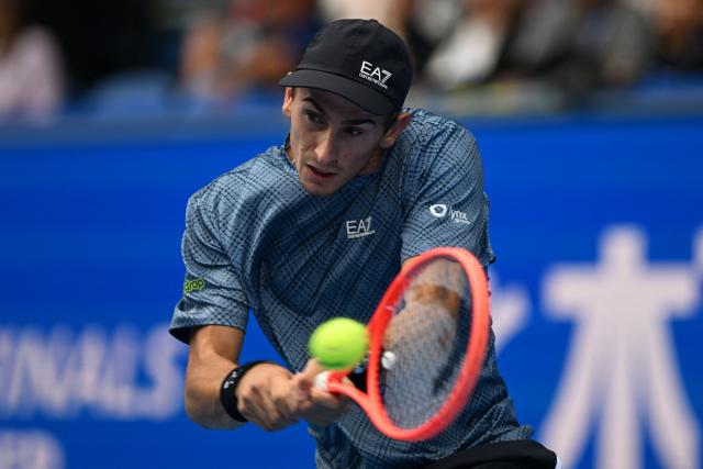 Italy's Matteo Arnaldi hits a return against Spain's Carlos Alcaraz during their men's singles tennis match at the ATP Tour Japan Open Tennis Championships at the Ariake Tennis Forest Park in Tokyo on October 3, 2026. (Photo by Rie KIKUCHI / AFP)