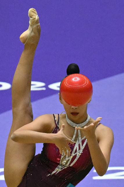 Kazakhstan's Akmaral Yerekesheva competes in the individual ball for the rhythmic gymnastics finals during the 2026 Asian Games at the Nagoya General Gymnasium in Nagoya on October 3, 2026. (Photo by MOHD RASFAN / AFP)