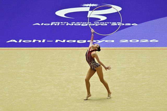 Japan's Kita Mirano competes in the individual ball for the rhythmic gymnastics finals during the 2026 Asian Games at the Nagoya General Gymnasium in Nagoya on October 3, 2026. (Photo by MOHD RASFAN / AFP)