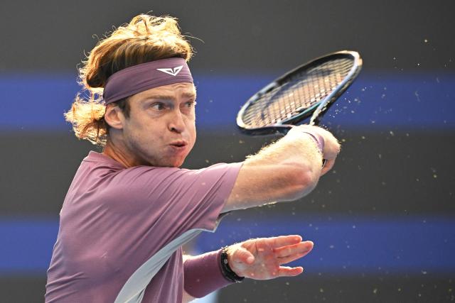 Russia’s Andrey Rublev hits a return to compatriot Roman Safiullin in their men’s singles match at the China Open tennis tournament in Beijing on October 3, 2026. (Photo by GREG BAKER / AFP)
