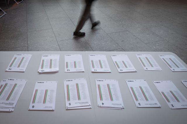 A voter arrives at a polling station to cast a ballot during Latvia's parliamentary elections in Riga on October 3, 2026. (Photo by Wojtek RADWANSKI / AFP)
