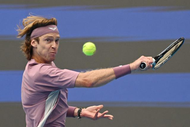 Russia’s Andrey Rublev hits a return to compatriot Roman Safiullin in their men’s singles match at the China Open tennis tournament in Beijing on October 3, 2026. (Photo by GREG BAKER / AFP)