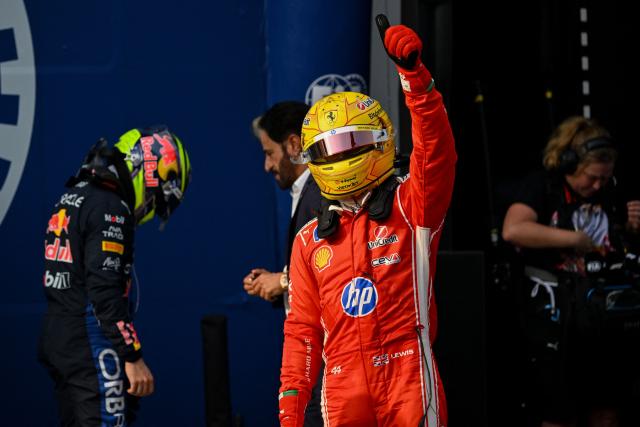 Ferrari's British driver Lewis Hamilton gestures after qualifying in second position following the qualifying session of the Formula One Bahrain Grand Prix in Sepang on October 3, 2026. (Photo by Jade Gao / AFP)