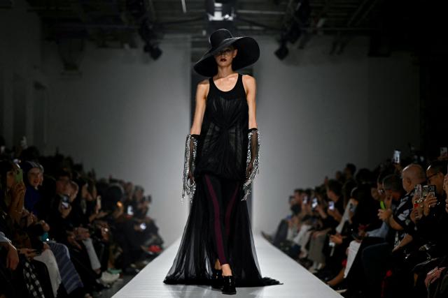 A model presents a creation for Junya Watanabe Women's Spring/Summer 2027 collection fashion show as part of the Paris Fashion Week, in Paris on October 3, 2026. (Photo by LOU BENOIST / AFP)