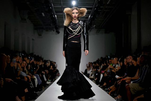 A model presents a creation for Junya Watanabe Women's Spring/Summer 2027 collection fashion show as part of the Paris Fashion Week, in Paris on October 3, 2026. (Photo by LOU BENOIST / AFP)