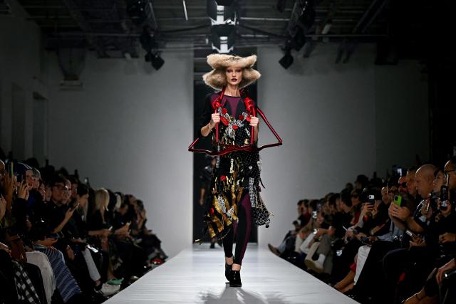 A model presents a creation for Junya Watanabe Women's Spring/Summer 2027 collection fashion show as part of the Paris Fashion Week, in Paris on October 3, 2026. (Photo by LOU BENOIST / AFP)