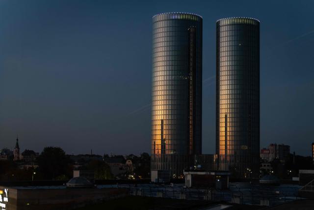The Zunda Towers skyscrapers rise above the Latvian capital Riga early in the morning on October 3, 2026. (Photo by Wojtek RADWANSKI / AFP)