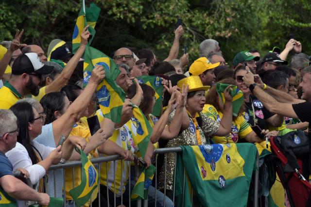 Supporters of Brazil's right-wing senator and presidential candidate Flavio Bolsonaro of the Liberal Party (PL) attend a campaign rally on the eve of the general election, in Santa Barbara d'Oeste, state of Sao Paulo, Brazil on October 3, 2026. Brazilians go to the polls on October 4, 2026, in a tight race led by leftist President Luiz Inacio Lula da Silva and right-wing senator Flavio Bolsonaro, son of imprisoned former president Jair Bolsonaro. (Photo by NELSON ALMEIDA / AFP)