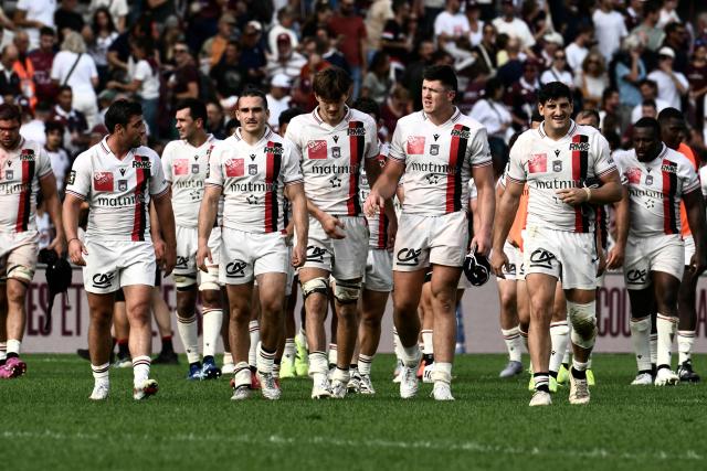 Lyon’s players walk out after their defeat at the end of the French Top14 rugby union match between Union Bordeaux Begles (UBB) and Lyon Olympique Universitaire (LOU) at the Chaban-Delmas stadium in Bordeaux, southwestern France, on October 3, 2026. (Photo by Philippe Lopez / AFP)