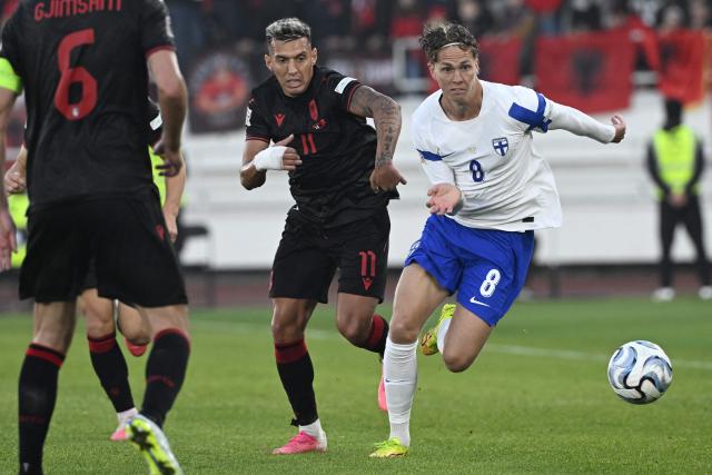 Finland's midfielder Onni Valakari (R) and Albania's forward #11 Myrto Uzuni vie for the ball during the UEFA Nations League Group C1 between Finland and Albania in Helsinki on October 3, 2026. (Photo by Emmi Korhonen / LEHTIKUVA / AFP) / Finland OUT