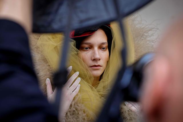 A model prepares ahead of the Vivienne Westwood Women's Spring/Summer 2027 collection fashion show as part of the Paris Fashion Week, in Paris on October 3, 2026. (Photo by GEOFFROY VAN DER HASSELT / AFP)