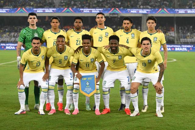 Brazil's players pose for a team photo ahead of the international friendly football match between India and Brazil at the Salt Lake Stadium in Kolkata on October 3, 2026. (Photo by Dibyangshu SARKAR / AFP)