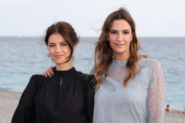 French actress Alice Dufour (L) and Swiss actress Charlotte Gabris (R)  pose during a photocall for the film "Instinct de famille" as part of the 8th edition of the Cineroman film festival in Nice, French Riviera, on October 3, 2026. (Photo by Valery HACHE / AFP)