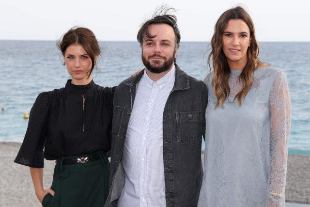 French actress Alice Dufour (L), French actor Jeremy Lopez (C) and Swiss actress Charlotte Gabris (R) pose  during a photocall for the film "Instinct de famille" as part of the 8th edition of the Cineroman film festival in Nice, French Riviera, on October 3, 2026. (Photo by Valery HACHE / AFP)