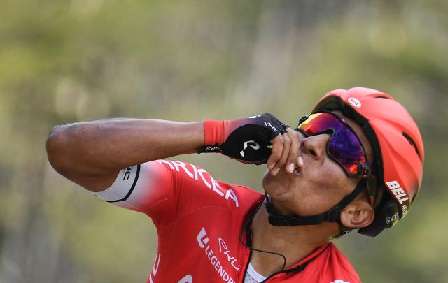 (FILES) Team Arkea Samsic Colombian rider Nairo Quintana celebrates as he crosses the finish line at the end of the 166,5 km, 7th stage of the 78th Paris - Nice cycling race stage between Nice and Valdeblore La Colmiane, on March 14, 2020. Quintana, the son of a farming family in the Andes, turned into a daring beetle who shook Colombia to its core, fighting epic battles that made him a legend. (Photo by Alain JOCARD / AFP)